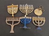 Five rhinestone menorah pins and 10 commandments token