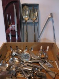 Two serving sets and assorted spoons, knives and serving pieces