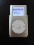 Apple IPod, silver, with cord and ear buds, working