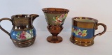 Three copper lustre pieces with raised decoration