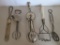 Five vintage kitchen utensils, beaters and advertising servers