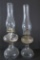 Two glass oil lamps