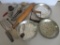 Vintage kitchen lot with advertising pie plates, rolling pin, utensils and beaters