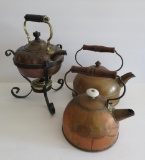 Three copper tea kettles