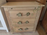 Three drawer dresser with metal leaf and vine handles, artist signed