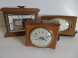 Three wooden alarm clocks