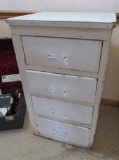 Wooden four drawer chest with glass drawer pulls