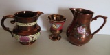 Three pieces of decorated copper lustre