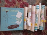 Vintage wallpaper rolls and wall paper sample book