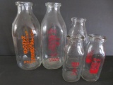 Five milk bottles, quart and pint