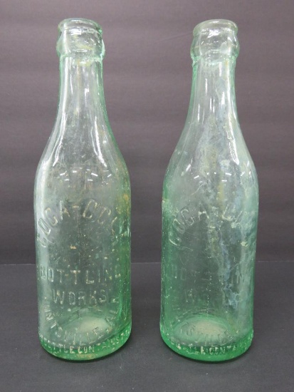 Two Huntsville Alabama Coca Cola bottles, aqua