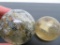 Two large handmade marbles, sulfide and latticino swirl