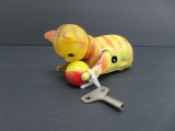Tin and plastic wind up cat with ball