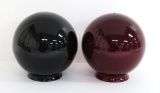 Two Ruby colored light fixture globes