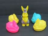 Five plastic colorful Easter candy containers and bunny