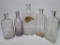 Five large pharmacy and medicine bottles, clear, 7 1/2