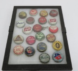 21 Vintage beer bottle caps in display case