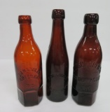 Three Wisconsin amber blob top bottles, 9