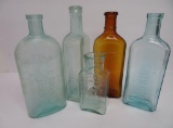 Five nice medicine bottles, amber and aqua