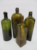 Four old olive green and yellow green bottles, 8