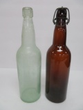 Two W F & S Milwaukee 1 bottles, amber and aqua