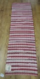Red woven rug, 82