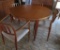 Round Danish Modern Round Table with four Moller chairs, two leaves