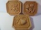 Three terra cotta style plaques, made it Italy