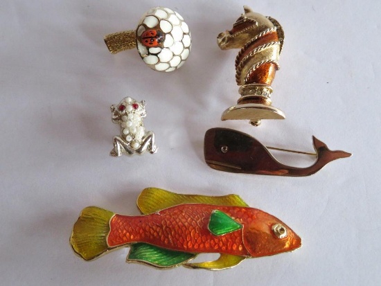 Five animal pins