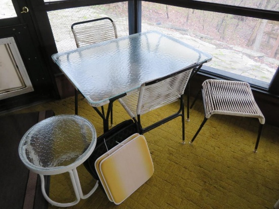 Glass top patio table with two chairs and side seat