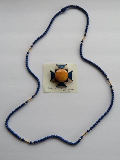 Sandor enamel pin and Royal Azure necklace