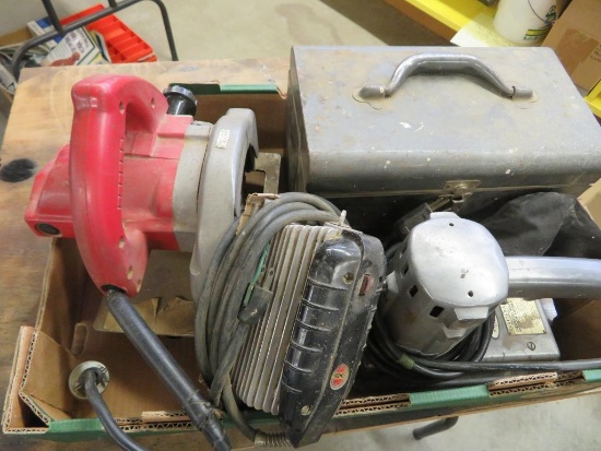 Four old power tools, sanders and saw