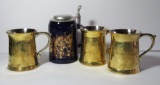 Three brass tankards and covered horse stein