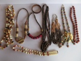 Assorted beaded necklaces, wood and plastic