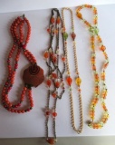 Celedon beaded necklaces and plastic colored beaded necklaces