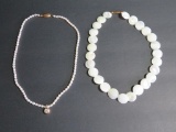 Pearl necklace and disc necklace