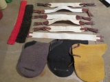 Assorted girths and saddle pads