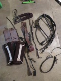 Assorted horse leathers, harness parts and pads