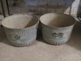 Two galvanized bushel baskets