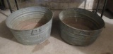 Two galvanized bushel baskets