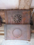 Ornate cast iron stove parts, two pieces