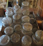 About 20 clear glass bail handle jars, pints, quarts, 1/2 gallon