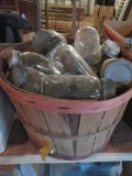 Assorted glass canning jars, mostly quarts in bushel basket