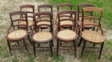 eight ladder back chairs with cane seats