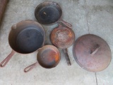 Five pieces of cast iron cookware