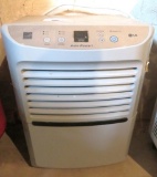 LG dehumidifier, tape to keep cabinet closed noted