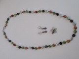 Beaded necklace, earrings and floral shape enhancer