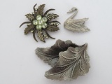 Three fashion pins, floral, leaf and swan