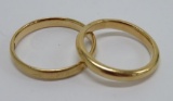 Two marked 18K gold wedding bands