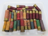 About 30 cardboard shotgun shells, variety of gauges